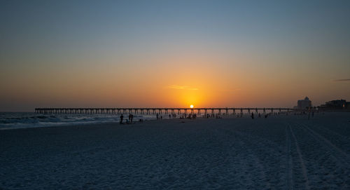 Scenic view of sea against clear sky during sunset