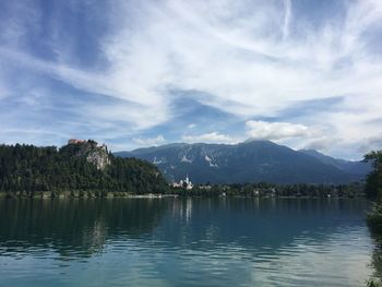 Scenic view of lake bled and mountain against sky