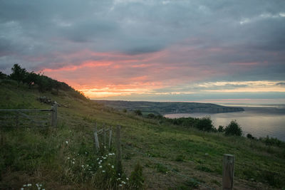 Scenic view of landscape against sky during sunset