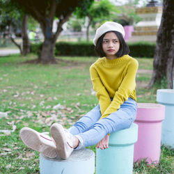 Portrait of woman sitting in park