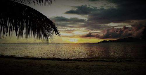 Scenic view of sea against sky at sunset