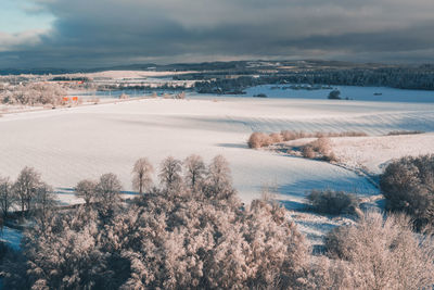 Scenic view of snow covered landscape against sky