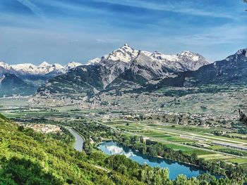 Scenic view of lake and mountains against sky