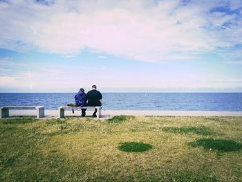 Scenic view of sea against cloudy sky