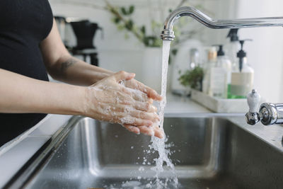 Woman washing her hands