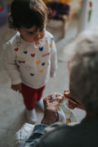 Grandmother with girl at home