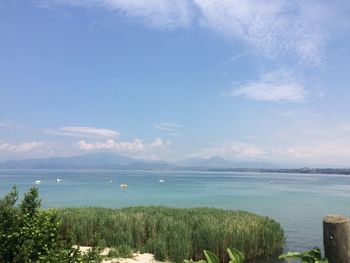 Scenic view of sea against blue sky