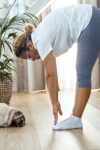 Low section of woman exercising in gym