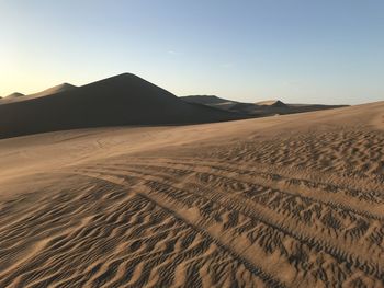 Scenic view of desert against clear sky