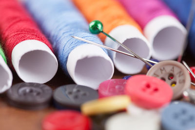 Close-up of colorful sewing items on table