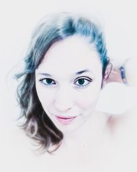 Close-up portrait of a smiling young woman