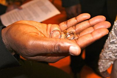 Cropped image of hand holding cigarette