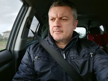 Mature man in car