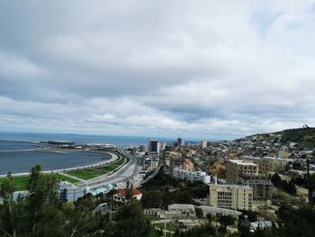 High angle view of buildings in city against sky