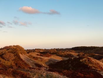 Scenic view of landscape against sky during sunset