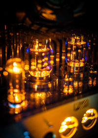 Illuminated tea light candles in temple