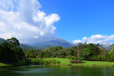 Scenic view of landscape against cloudy sky