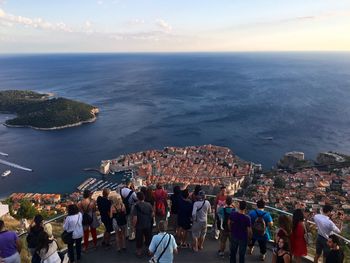 High angle view of people by sea against sky