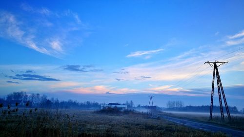 Scenic view of trees against blue sky