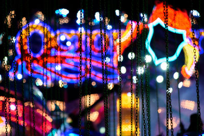 Close-up of illuminated carousel at amusement park