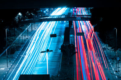 Light trails on road in city at night