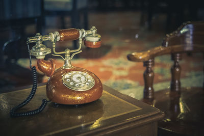 Close-up of old-fashioned antique rotary phone on table