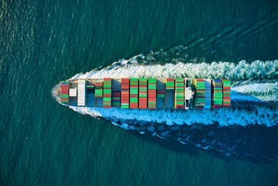 High angle view of boat sailing on sea shore