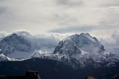 Scenic view of snowcapped mountains against sky