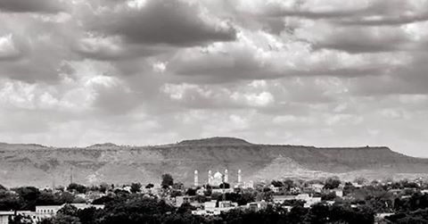 Townscape against cloudy sky