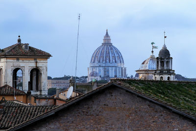 Panorama of rome, domes and roofs. in the center, the dome of st. peter's basilica.