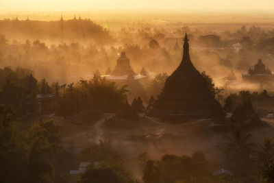 Panoramic view of temple against sky during sunset