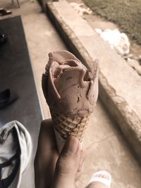 Midsection of person holding ice cream cone