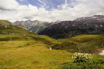 Scenic view of landscape and mountains against sky