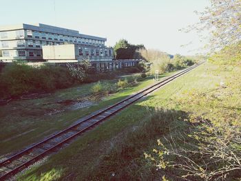 Railroad track against clear sky