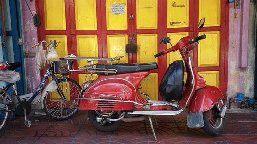 Bicycles parked against wall