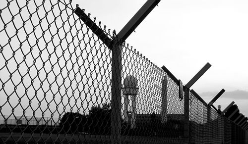 Low angle view of chainlink fence