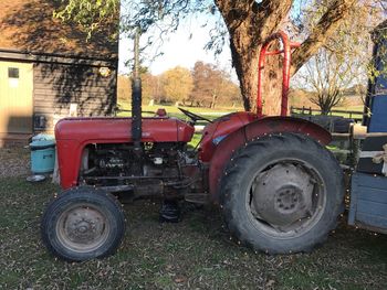 Close-up of tractor against trees