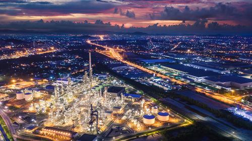 Refinery industry zone at night and lighting cityscape with twilight sky background 