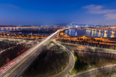 High angle view of light trails on road at night