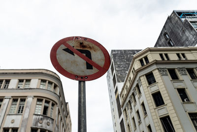 Sign indicating that turning left is prohibited. commercial neighborhood 