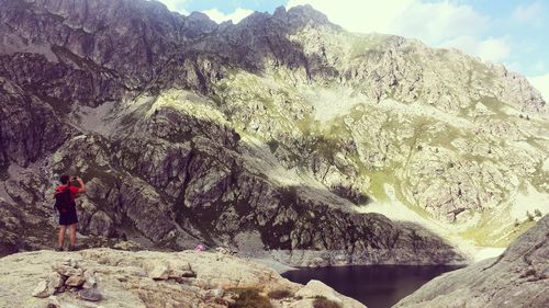 Man photographing mountains