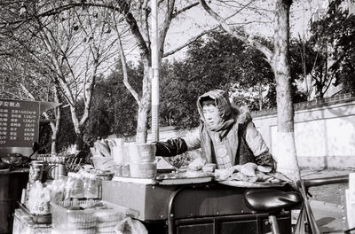 Man and woman sitting on table at restaurant