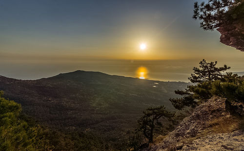 Scenic view of mountains against sky during sunset