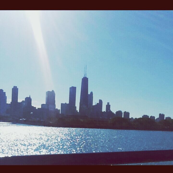 city, architecture, water, building exterior, built structure, transfer print, cityscape, skyscraper, urban skyline, waterfront, river, auto post production filter, skyline, sky, clear sky, blue, financial district, sea, office building, reflection