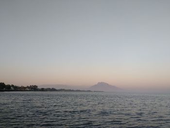 Scenic view of sea against clear sky during sunset