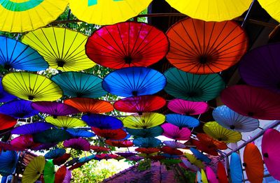 Low angle view of multi colored lanterns hanging in row