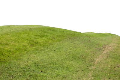 Scenic view of green landscape against sky