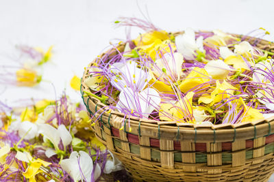 Close-up of yellow flowers in basket