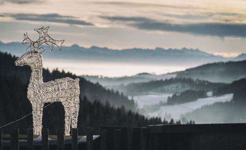Scenic view of mountains against sky during sunset