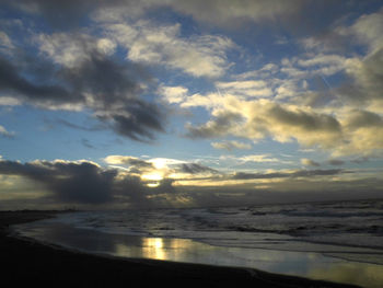 Scenic view of sea against dramatic sky